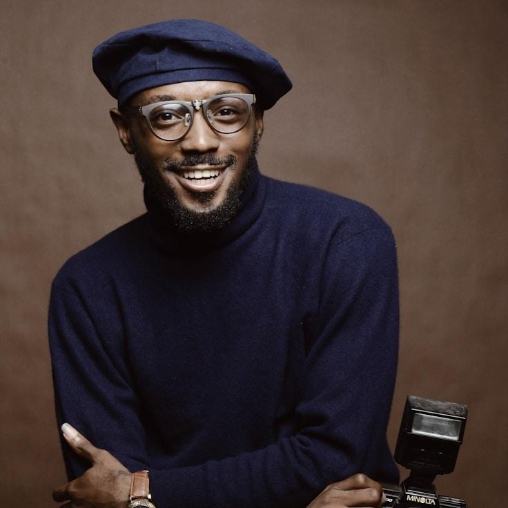 Kaveri Mehta, Lead Design Curator at Modern Life Growth, reviewing corporate floral arrangements